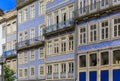 Facades of traditional houses decorated with ornate Portuguese azulejo tiles in Porto, Portugal Royalty Free Stock Photo