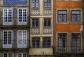 Facades of traditional houses decorated with ornate Portuguese azulejo tiles in Porto, Portugal Royalty Free Stock Photo