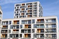 Facades of two modern white apartment buildings with balcony in contemporary residential district