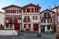 Facades of typical Basque houses in the touristic village of Ainhoa, France Royalty Free Stock Photo