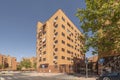 Facades of urban residential houses made of clay bricks and reddish