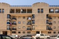 Facades of urban residential houses painted clay vanilla color