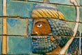 Face of ancient man, ceramic patterned wall of city Babylon