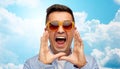 Face of angry shouting man in shirt and sunglasses Royalty Free Stock Photo