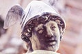 Face of antique god of commerce, merchants and travelers Hermes Mercury. Ancient statue. He is olympic gods messenger with wings Royalty Free Stock Photo