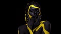 Face art. Dancing woman with black and yellow body paint. Young african girl with colorful bodypaint. An amazing afro