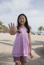 Face of asian girl show finger acting as a symbolic of number