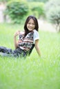 Face of asian woman relaxing emotion sitting on g Royalty Free Stock Photo