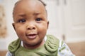 Face, baby and black child in home, cute or enjoying time alone in South Africa. African newborn, children and portrait Royalty Free Stock Photo