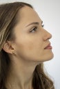 The face of a beautiful girl close-up. Her earlobe is fused. Woman with a elf's ear Royalty Free Stock Photo