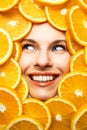 Face of a beautiful girl in orange slices Royalty Free Stock Photo