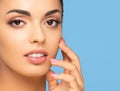 Face of a beautiful oriental brunette girl. Close-up portrait of young and attractive woman with brown eyes. Royalty Free Stock Photo