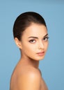 Face of a beautiful oriental brunette girl. Close-up portrait of young and attractive woman with brown eyes. Royalty Free Stock Photo