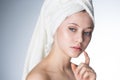 Face of a beautiful young woman with a towel Royalty Free Stock Photo