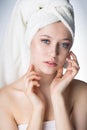 Face of a beautiful young woman with a towel Royalty Free Stock Photo