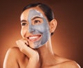 Face, beauty skincare and woman with clay mask in studio isolated on a brown background. Makeup, aesthetics and happy