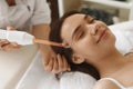 Face Beauty Treatment. Woman Using Darsonval Skin Care Device Royalty Free Stock Photo