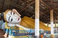 Face of big white reclining Buddha red lip statue in myanmar temple