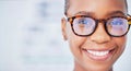 Face, black woman and glasses in ophthalmology, smile and vision in healthcare for wellness in hospital. Portrait, frame Royalty Free Stock Photo