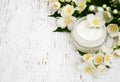 Face and body cream moisturizers with jasmine flowers Royalty Free Stock Photo