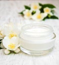 Face and body cream moisturizers with jasmine flowers Royalty Free Stock Photo