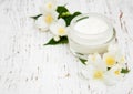 Face and body cream moisturizers with jasmine flowers Royalty Free Stock Photo