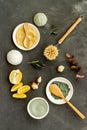 Face, body skin care homemade ingredients - cosmetic clay, brushes, homemade soap, scrub, herbs on a gray background
