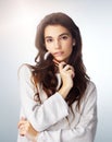 Face brush, natural makeup and beauty of a woman in studio with a glow. Portrait of a female model person on a grey Royalty Free Stock Photo