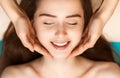 Face building facial gymnastics massage and rejuvenating exercises for woman face in beauty spa Royalty Free Stock Photo