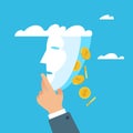 Face of the business brings money. Hand holds mask, golden coins fall, emotional control on meeting to achieving goals