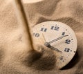 Face of clock in sand Royalty Free Stock Photo