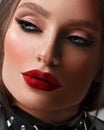 Face close-up. Portrait of a woman. Beige lipstick on the lips. Royalty Free Stock Photo