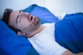 Face close up of snoring man because of hypopnea disorder