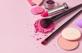 Face cosmetics on pink background