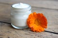 Face cream and calendula flower.Cosmetics. Royalty Free Stock Photo