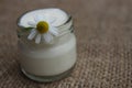 Face cream with flowers of chamomile.Cosmetics.