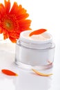 Face cream and gerbera flowers Royalty Free Stock Photo