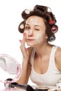 Face cream and hair curlers Royalty Free Stock Photo