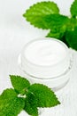 Face cream in jar with urtica