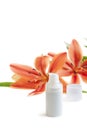 Face cream with lily flowers, on white Royalty Free Stock Photo