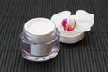 Face cream and orchid Royalty Free Stock Photo