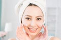 Face cream woman applying skin cream on the cheeks. Beauty eye contour wrinkle cream or anti-aging skin care cream