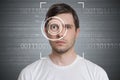 Face detection and recognition of man. Computer vision concept. Binary code in background Royalty Free Stock Photo