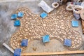 Face-down pieces of Zellige terracotta glazed tiles to form a Moroccan mosaic pattern. Royalty Free Stock Photo