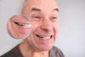 Face of European old man close up, wrinkles on aging skin, opened mouth, concept of dentistry, cosmetology, age-related changes Royalty Free Stock Photo