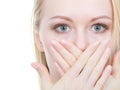 Shocked young woman covering mouth with hand Royalty Free Stock Photo