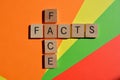 Face Facts, in wooden alphabet letters on a multicoloured background