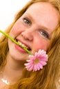 Face of a girl with pink flower Royalty Free Stock Photo