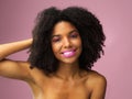 Face, hair care and happy black woman with makeup in studio isolated on a pink background with eyeshadow. Hairstyle