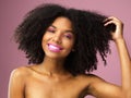 Face, hair care and smile of black woman with afro in studio isolated on pink background with eyeshadow. Hairstyle